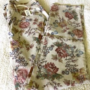 Floral motif straight leg denim pant.